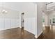 Dining room showing wainscoting detail, hardwood floors, and entry to the kitchen at 3914 Old Chapel Hill Rd, Durham, NC 27707