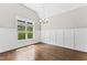 Bright dining room showcases natural light through a large window and a modern chandelier at 3914 Old Chapel Hill Rd, Durham, NC 27707