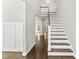 Bright foyer with hardwood floors and staircase, creating an inviting entrance at 3914 Old Chapel Hill Rd, Durham, NC 27707