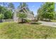 Beautiful home with a lush green lawn and mature trees in a serene neighborhood setting at 3914 Old Chapel Hill Rd, Durham, NC 27707