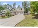 Inviting home featuring a double garage, ample parking, and lovely curb appeal at 3914 Old Chapel Hill Rd, Durham, NC 27707