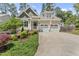 Charming home with a two-car garage, landscaped front yard, and an inviting entrance at 3914 Old Chapel Hill Rd, Durham, NC 27707