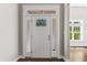 Elegant white front door with glass panels and sidelights, offering a bright entry at 3914 Old Chapel Hill Rd, Durham, NC 27707