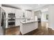 Spacious kitchen with stainless steel appliances, granite counters, and an island with seating at 3914 Old Chapel Hill Rd, Durham, NC 27707
