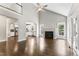 Bright living room features a vaulted ceiling, ceiling fan, and a cozy fireplace at 3914 Old Chapel Hill Rd, Durham, NC 27707