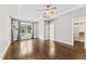 Primary bedroom showcases hardwood floors, tray ceilings, and a view of backyard at 3914 Old Chapel Hill Rd, Durham, NC 27707