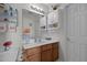 Well-lit bathroom featuring a toilet, sink, mirror and white vanity with drawers at 4216 Lake Woodard Dr, Raleigh, NC 27604
