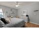 Bedroom with wood floors, a comfortable bed, a dresser, and natural light from the window at 4216 Lake Woodard Dr, Raleigh, NC 27604