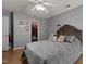 Bedroom with wood floors, a comfortable bed, and a walk-in closet at 4216 Lake Woodard Dr, Raleigh, NC 27604
