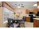 Cozy dining area with seating for four, a ceiling fan, and plenty of natural light at 4216 Lake Woodard Dr, Raleigh, NC 27604