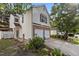Charming two-story home featuring a two-car garage, brick accents, and well-manicured landscaping at 4216 Lake Woodard Dr, Raleigh, NC 27604