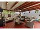 Charming patio with ample seating, an outdoor fan, and views of the backyard at 4216 Lake Woodard Dr, Raleigh, NC 27604