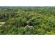 Aerial view of home in a private lot with lush trees at 4306 Infinity Ln, Durham, NC 27705