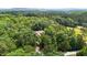 Aerial view of the beautiful home surrounded by mature trees at 4306 Infinity Ln, Durham, NC 27705