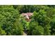 Aerial view of the beautiful home surrounded by mature trees at 4306 Infinity Ln, Durham, NC 27705
