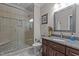 Updated bathroom showcasing a glass-enclosed shower and granite vanity at 4306 Infinity Ln, Durham, NC 27705
