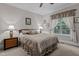 Comfortable bedroom with a large window and ceiling fan for relaxing at 4306 Infinity Ln, Durham, NC 27705