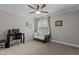 Cozy bedroom showcasing a futon, computer desk, and a ceiling fan at 4306 Infinity Ln, Durham, NC 27705