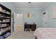 Bedroom with carpet flooring and pale blue walls at 4306 Infinity Ln, Durham, NC 27705
