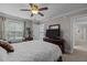 Comfortable bedroom with a ceiling fan, a window, and neutral decor at 4306 Infinity Ln, Durham, NC 27705