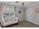 Bedroom with a futon near a window that brings in natural light and features a ceiling fan at 4306 Infinity Ln, Durham, NC 27705