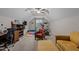 Large bonus room with workout equipment, furniture, television, and storage shelves at 4306 Infinity Ln, Durham, NC 27705