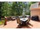 Spacious deck area with outdoor dining set, seating, and natural light at 4306 Infinity Ln, Durham, NC 27705