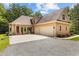 Spacious three-car garage and rear exterior of home at 4306 Infinity Ln, Durham, NC 27705