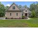 Charming two-story home with neutral siding, well-manicured lawn, and attractive landscaping at 4306 Infinity Ln, Durham, NC 27705