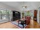 Cozy living room with hardwood floors, large windows, and comfortable seating at 4306 Infinity Ln, Durham, NC 27705