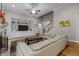 Open-concept living room features hardwood floors, built in shelving, and staircase at 4306 Infinity Ln, Durham, NC 27705