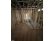 Unfinished bathroom with exposed wood beams and shower installation at 448 Golden Dragonfly St, Wake Forest, NC 27587