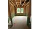 Unfinished bedroom features studs and two windows at 448 Golden Dragonfly St, Wake Forest, NC 27587