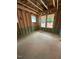 Bedroom framing within new construction, featuring window openings for natural light at 448 Golden Dragonfly St, Wake Forest, NC 27587