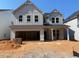 New two-story home featuring board and batten siding and an attached two-car garage at 448 Golden Dragonfly St, Wake Forest, NC 27587