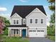 Charming two-story home with vertical siding, attached garage and a welcoming covered front porch at 448 Golden Dragonfly St, Wake Forest, NC 27587