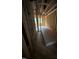 Unfinished hallway featuring exposed wood beams and natural light from multiple windows at 448 Golden Dragonfly St, Wake Forest, NC 27587