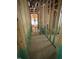 Unfinished hallway showcases stud framing and plumbing components at 448 Golden Dragonfly St, Wake Forest, NC 27587