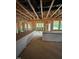 Exposed wooden beams inside, creating an open space waiting to be transformed at 448 Golden Dragonfly St, Wake Forest, NC 27587