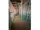 Exposed framing inside new home construction, including wiring for lights and fixtures at 448 Golden Dragonfly St, Wake Forest, NC 27587