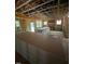 Unfinished living room featuring exposed wood beams and natural light from multiple windows at 448 Golden Dragonfly St, Wake Forest, NC 27587