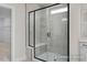 Contemporary walk-in shower with a glass enclosure, a built-in bench, and modern tile work at 448 Golden Dragonfly St, Wake Forest, NC 27587