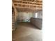 Unfinished basement displaying exposed framing, insulation, windows, and stairs to the main level at 456 Golden Dragonfly St, Wake Forest, NC 27587