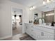 Bright bathroom with double vanity, and a view to the bedroom at 456 Golden Dragonfly St, Wake Forest, NC 27587