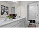 Bathroom featuring double sinks with white countertops and a view into the shower at 456 Golden Dragonfly St, Wake Forest, NC 27587