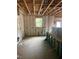 Unfinished bedroom interior featuring exposed framing, insulation, and a window view to the outside at 456 Golden Dragonfly St, Wake Forest, NC 27587