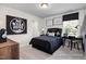 This bedroom has a black and white theme, a workspace, and a graphic sign at 456 Golden Dragonfly St, Wake Forest, NC 27587