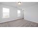 Bedroom with neutral carpet, two windows, fresh paint and ready for your personal touch at 456 Golden Dragonfly St, Wake Forest, NC 27587