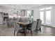 Elegant dining area adjacent to a modern kitchen, perfect for Gathering meals and entertaining at 456 Golden Dragonfly St, Wake Forest, NC 27587