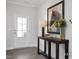 Inviting foyer with a decorative table, flowers, and a horse picture that enhances its style at 456 Golden Dragonfly St, Wake Forest, NC 27587